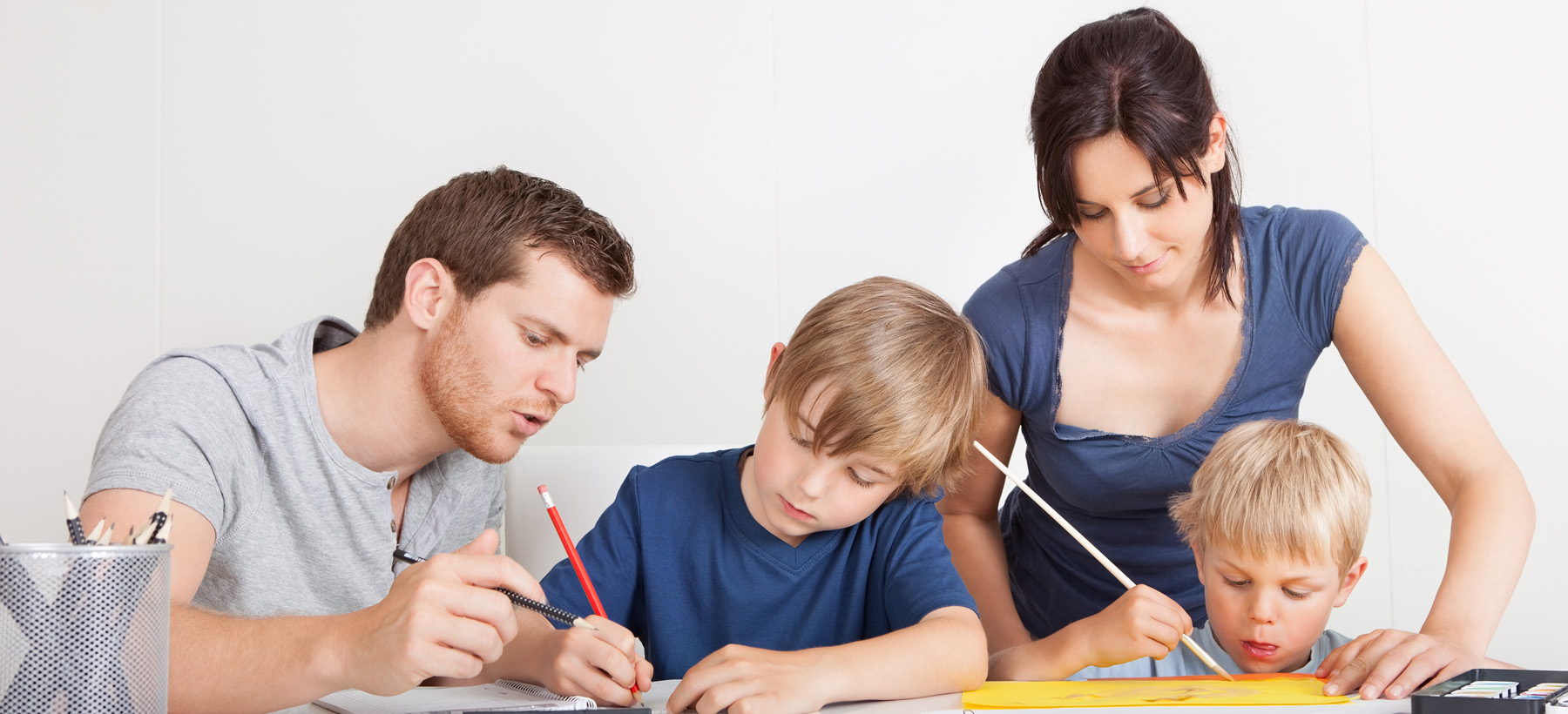 Parents working with their two children